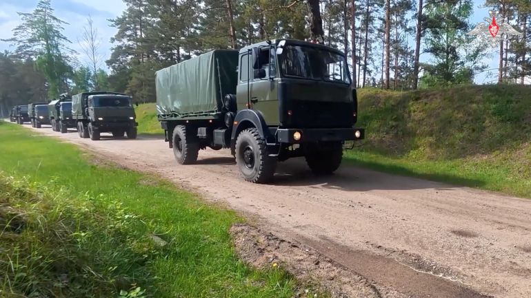 swarykh-1779352883 Military trucks drive along a road during nuclear forces exercises at an unidentified location in Belarus, in this still image taken from handout footage released on May 21, 2026. Russia delivered nuclear munitions to field storage facilities in Belarus as part of major nuclear drills, the Russian Defence Ministry said on Thursday. Russian Defence Ministry/Handout via REUTERS ATTENTION EDITORS - THIS IMAGE WAS PROVIDED BY A THIRD PARTY. NO RESALES. NO ARCHIVES. MANDATORY CREDIT. WATERMARK FROM SOURCE.