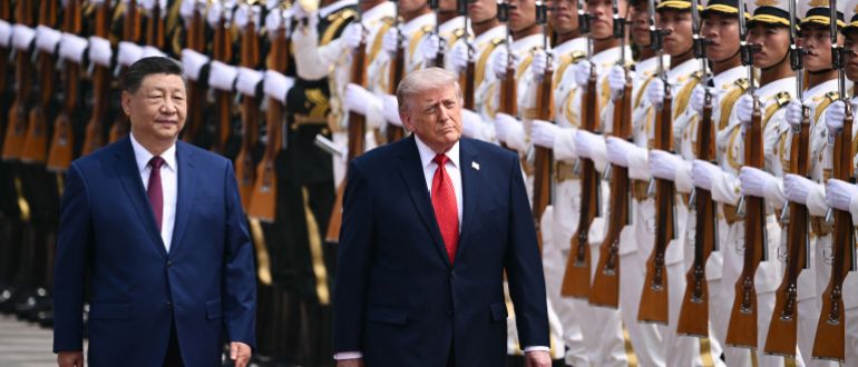 trump8-1778736610 US President Donald Trump (R) and China's President Xi Jinping inspect a guard of honour during a welcome ceremony at the Great Hall of the People in Beijing on May 14, 2026. (Photo by Brendan SMIALOWSKI / AFP)