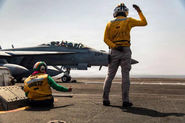 U.S. sailors signal to an F/A-18F Super Hornet aircraft, attached to Strike Fighter Squadron 213, on the flight deck of the USS Gerald R. Ford for a mission supporting Operation Epic Fury during the Iran war at an undisclosed location, March 19, 2026. U.S. Navy/Handout via REUTERS ATTENTION EDITORS - THIS PICTURE WAS PROVIDED BY A THIRD PARTY