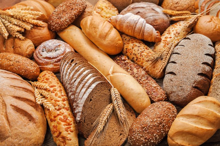 022030-3-1693744418 Fresh fragrant bread on the table. Food concept