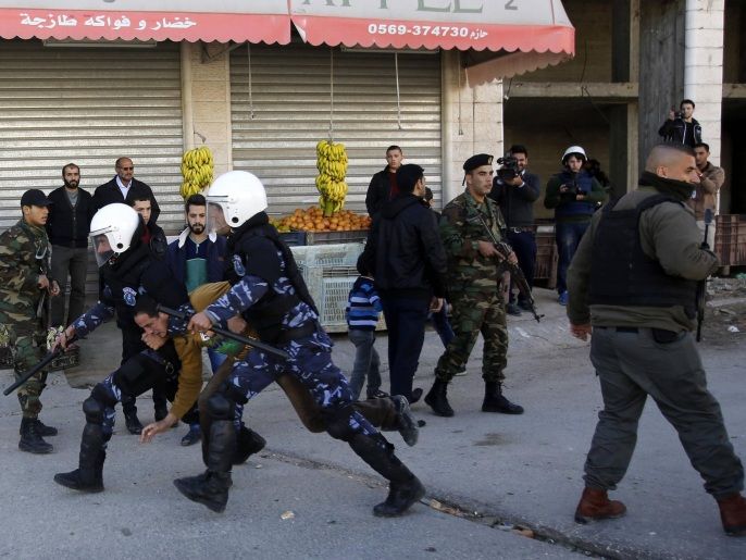 09ac1437-96b8-4953-830c-d23f8293d27d Palestinian policemen detain a Palestinian protester during an anti-Israel protest against what organizers say are recent visits by Jewish activists to al-Aqsa mosque, in the West Bank city of Hebron November 7, 2014. In recent months, a campaign for the prayer ban on Jewish worshippers at the site, known to Muslims as the Noble Sanctuary and to Jews as Temple Mount, to be overturned, led by settler activists, has gathered momentum, raising alarm among Palestinians and Muslims further afield who fear that the Islamic oversight of the compound that has existed since the crusades is threatened. Prime Minister Benjamin Netanyahu insists the status quo will not change, but his reassurances have done little to calm nerves or religious sensitivities. Tensions over the compound, the third holiest site in Islam and the holiest place in Judaism, have fueled daily clashes between Israeli security forces and Palestinians in Jerusalem in recent weeks. REUTERS/Mussa Qawasma (WEST BANK - Tags: POLITICS CIVIL UNREST RELIGION)