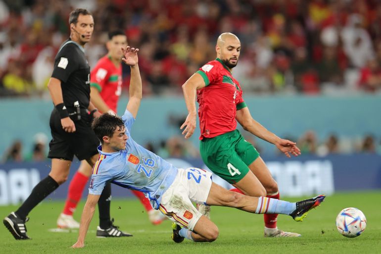 11181532 epa10352065 Sofyan Amrabat (R) of Morocco in action against Pedri of Spain during the FIFA World Cup 2022 round of 16 soccer match between Morocco and Spain at Education City Stadium in Doha, Qatar, 06 December 2022. EPA-EFE/Friedemann Vogel