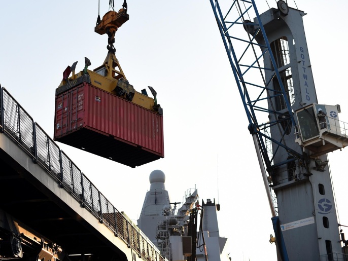 140b72ad-27b5-4747-9f42-46fc5a2dae7f A container is unloaded form the Royal Netherlands Navy Karel Doorman at the port of Freetown on November 19, 2014. Ebola-hit Sierra Leone faces social and economic disaster as gains made since the country's ruinous civil war are wiped out by the epidemic, according to a major study by the finance ministry and the United Nations Development Programme (UNDP). AFP PHOTO/ FRANCISCO LEONG