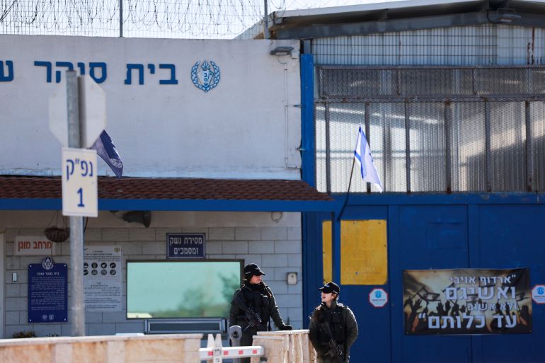 20fire-1761802972 Members of Israeli forces stand outside the Israeli military prison, Ofer, on the day Israel is expected to release Palestinian prisoners as part of a hostages-prisoners swap and a ceasefire deal in Gaza between Hamas and Israel, near Ramallah, in the Israeli-occupied West Bank, February 15, 2025. REUTERS/Ammar Awad