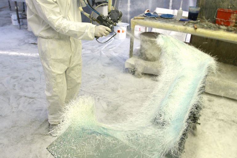 A technician works on a fiberglass component of a car in the PGO factory in Ales, south eastern France, 24 January 2007. After the company filed for bankruptcy in December 2006, the new CEO Mohamed Zouhir Boudemagh who took 51% of the shares, wants to ensure the financial recovery with a prospect of selling 400 vehicules a year. One of the last independent manufacturers in France, PGO creates tailor-made retro sports cars. There are 12 distributors in France of PGO cars and a few other European countries. The 70 employees of this small business produce almost everything on the premises and assemble the cars by hand at the rate of one per day. First created in 1980 in Alsace by two brothers Gilles and Olivier Prevost (using their initials for their brand) PGO specialized in creation of replicas of luxury sports cars such as Lotus Seven, AC Cobra, and Porsche 356 Speedster. In 2004 Porsche filed a complaint against PGO for "counterfeiting and unfair competition" and banned it from producing replicas of the 356 Speedster. Porsche's claims was dismissed on appeal. AFP/PASCAL GUYOT (Photo by Pascal GUYOT / AFP)