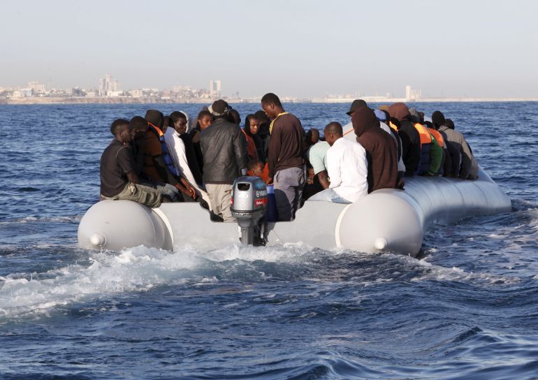 Migrants, who tried to flee to Europe, travel in a dinghy after they were stopped by Libyan coast guards and made to head to Tripoli September 29, 2015. The North African country has turned into a major hub for human traffickers smuggling African migrants by boat to Italy, with the Libyan coastguard under pressure from Europe to stem the flow. REUTERS/Ismail Zitouny