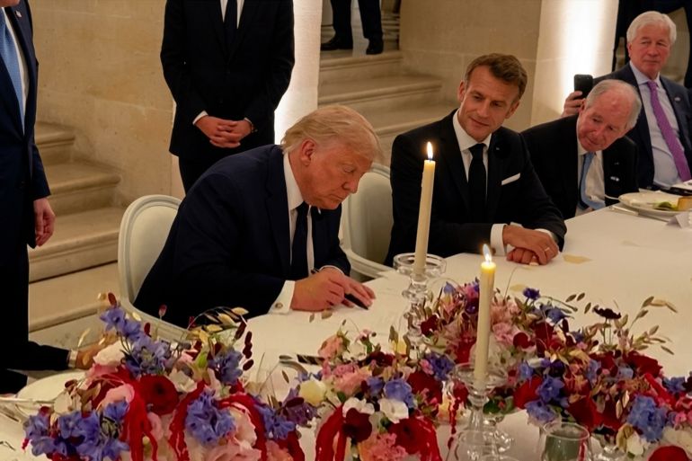 323232-1781776981 TOPSHOT - This screengrab from videofootage made available on June 18, 2026, from the X account of Deputy Chief of Staff at The White House Dan Scavino shows US President Donald Trump (C) next to France's President Emmanuel Macron (R), his wife Brigitte Macron (L), US Secretary of State Marco Rubio and France's Foreign Affairs Minister Jean-Noel Barrot during the signing of a deal with Iran to end the Middle East war, inside Chateau de Versailles, in Versailles southwest of Paris on June 17, 2026. (Photo by @Scavino47 / AFP) / NO USE AFTER JULY 17, 2026 22:00:00 GMT - XGTY - RESTRICTED TO EDITORIAL USE - MANDATORY CREDIT « AFP PHOTO / @SCAVINO47 » - NO MARKETING NO ADVERTISING CAMPAIGNS - DISTRIBUTED AS A SERVICE TO CLIENTS - NO ARCHIVE