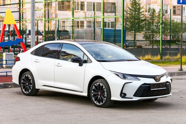 54tre-1773397172-1 Novyy Urengoy, Russia - June 24, 2021: Brand new car Toyota Corolla in the city street.