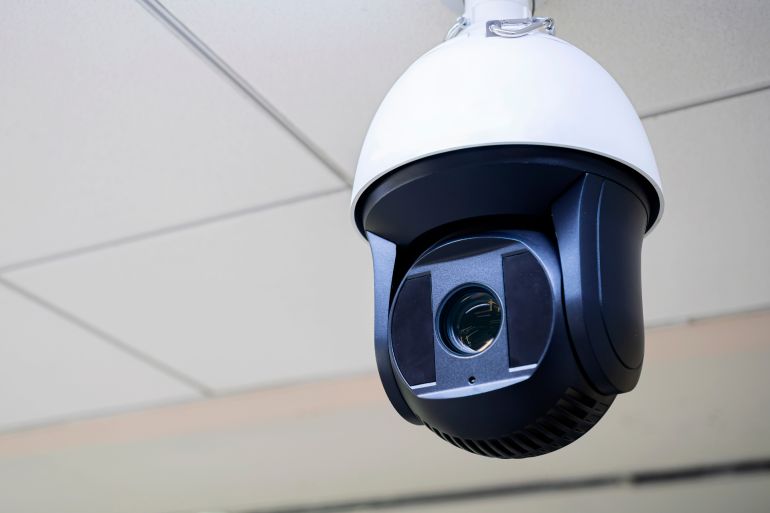 558-1724785414 Closed-circuit television,Security CCTV camera or surveillance system in background of Checkpoint - Body and bag Luggage Scan Machine ,Secure Airport Check In,vintage color شترستوك