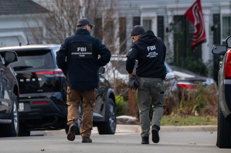 564-1765815024 WOODBRIDGE, VIRGINIA - DECEMBER 4: FBI agents gather in front of the home of suspected January 6th, 2021 pipe bomber on December 4, 2025 in Woodbridge, Virginia. Federal agents have arrested a suspect identified as Brian Cole they are alleging placed two pipe bombs, which never exploded, the night before the January 6th, 2021 U.S. Capitol attack. Andrew Leyden/Getty Images/AFP (Photo by Andrew Leyden / GETTY IMAGES NORTH AMERICA / Getty Images via AFP)