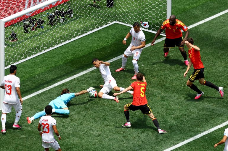 6987h-1782141515 Soccer Football - FIFA World Cup 2026 - Group G - Belgium v Iran - Los Angeles Stadium, Inglewood, California, U.S. - June 21, 2026 Iran's Alireza Beiranvand in action with Belgium's Maxim De Cuyper, Iran's Ali Nemati and Belgium's Hans Vanaken as he makes a save REUTERS/Lisi Niesner TPX IMAGES OF THE DAY