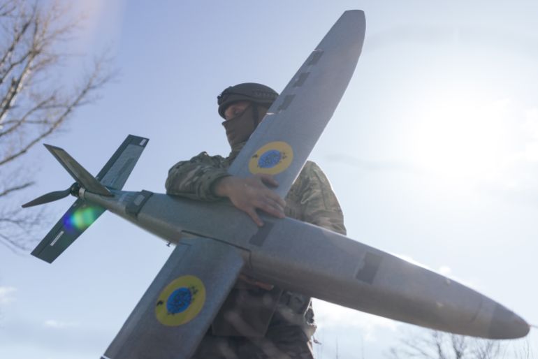 6drone-1781944001 KHARKIV REGION, UKRAINE - APRIL 7: A portrait of a soldier from the "Taifun" unmanned aerial vehicle unit holding a new model 'Marsianin' attack drone on April 7, 2026 in Kharkiv region, Ukraine. After years of developing systems and know-how to fend off Russia's drone attacks, Ukraine is now offering its hard-won expertise and counter-drone technology to other countries. In recent weeks, Ukrainian President Volodymyr Zelensky has been visiting Gulf states who are confronting a wave of relatively cheap kamikaze drones launched by Iran as it lashes out neighboring countries after the joint U.S.-Israeli attack. (Photo by Nikoletta Stoyanova/Getty Images)