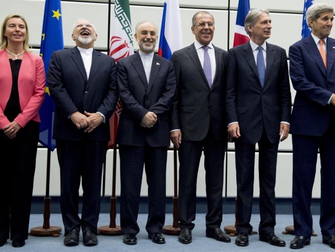 79898c37-4e7b-4d75-a32f-51c7c1b94fbf (From L to R) European Union High Representative for Foreign Affairs and Security Policy Federica Mogherini, Iranian Foreign Minister Mohammad Javad Zarif, Head of the Iranian Atomic Energy Organization Ali Akbar Salehi, Russian Foreign Minister Sergey Lavrov, British Foreign Secretary Philip Hammond and US Secretary of State John Kerry pose for a group picture at the United Nations building in Vienna, Austria July 14, 2015. Iran and six major world powers reached a nuclear deal, capping more than a decade of on-off negotiations with an agreement that could potentially transform the Middle East, and which Israel called an 'historic surrender'. AFP PHOTO / POOL / JOE KLAMAR