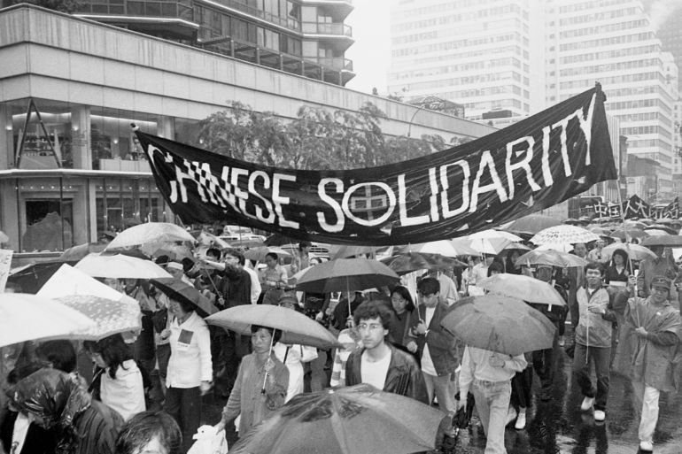 Protesters carry a banner at a demonstration against the Chinese government's brutality during the protests in Tiananmen Square in 1989 in New York City, New York. (Photo by Thomas McGovern/Getty Images)