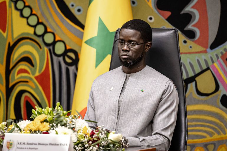 (FILES) Senegal President Bassirou Diomaye Faye attends a ceremony after receiving the official report on the Thiaroye massacre, at the Presidential Palace in Dakar, on October 16, 2025.