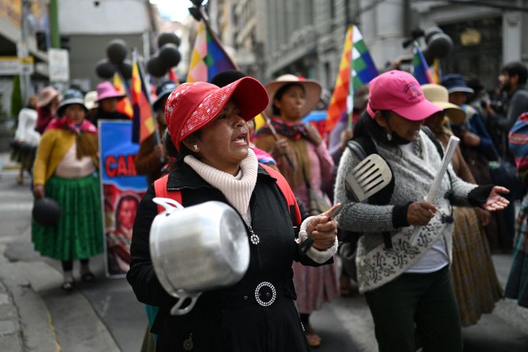 afp_6a17c4006e80-1779942400 An Indigenous woman bangs pots and pans during a protest against the government of President Rodrigo Paz on Mother's Day in La Paz on May 27, 2026. (Photo by Marvin RECINOS / AFP)