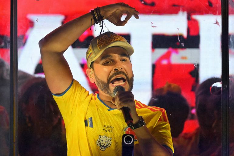 Colombia's presidential candidate Abelardo de la Espriella, of the Salvadores de la Patria movement, speaks to supporters behind bulletproof glass after a quick count of votes in the presidential election at the Ventana al Mundo monument in Barranquilla, Colombia, on May 31, 2026.