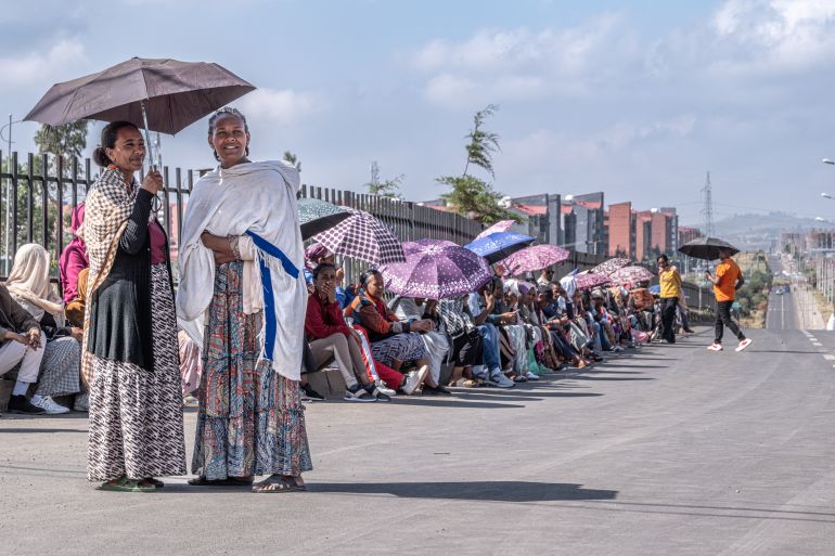 afp_6a1d69c7610d-1780312519 TOPSHOT - Voters hold umbrellas to protect themselves from the sun as they queue to cast their ballots outside the Beshale Katla polling station in Addis Ababa, on June 1, 2026, during the 2026 Ethiopian parliamentary elections.