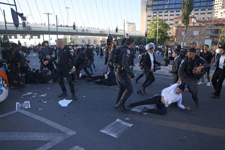 Israeli police disperse ultra-Orthodox Jews protesting against conscription by blocking the entrance to Jerusalem, on June 1, 2026.