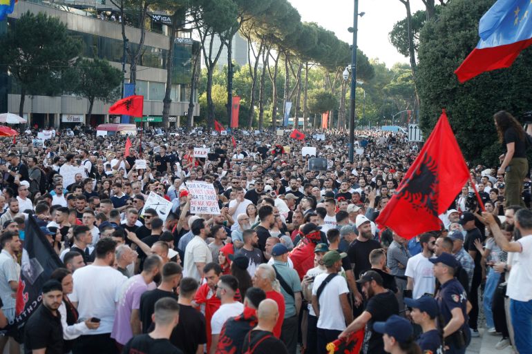 Protestors take part in a demonstration in front of the prime minister's office, against the construction of a luxury resort near a protected natural area, in Tirana on June 2, 2026.
