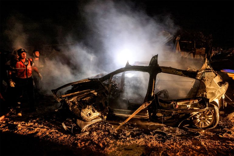 afp_6a254a23e20b-1780828707 EDITORS NOTE: Graphic content / TOPSHOT - People and first responders gather at the scene following Israeli bombardment on Khan Yunis in the southern Gaza Strip late on June 6, 2026.