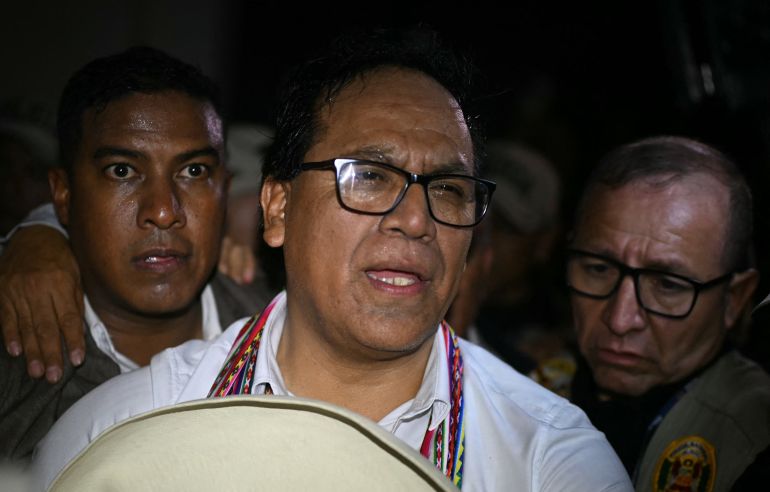 afp_6a26645aad03-1780900954 Peru's presidential candidate Roberto Sanchez, for the Juntos por el Peru party, gestures after a speech following the first results of the presidential election runoff in Lima on June 7, 2026.