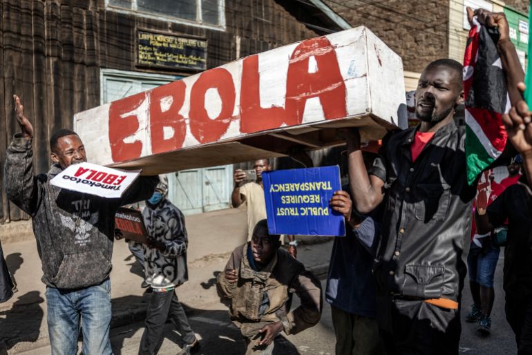 afp_6a27ffb469b2-1781006260 TOPSHOT - Protesters carry a mock coffin as they march during a demonstration against a controversial US-built Ebola quarantine centre slated to begin operations at Laikipia Air Base in Nanyuki on June 9, 2026.