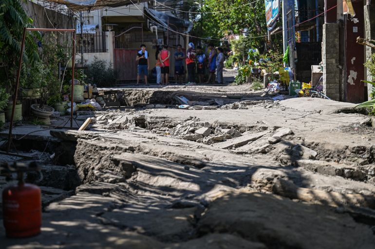 afp_6a28067b9f4d-1781007995 This photo shows a damaged road after a 7.8 magnitude earthquake in General Santos City on June 9, 2026.