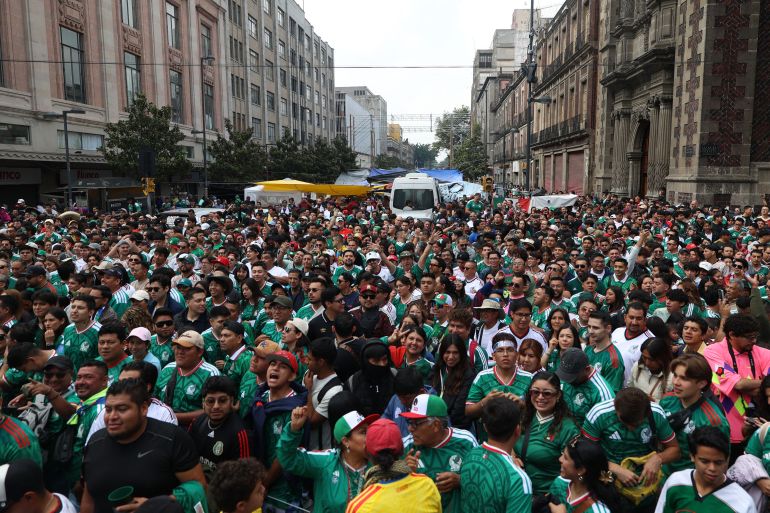 afp_6a2ad4ad0ad7-1781191853 Mexican fans gather in the fan zone ahead of the 2026 World Cup football tournament Group A football match between Mexico and South Africa in Mexico City on June 11, 2026.