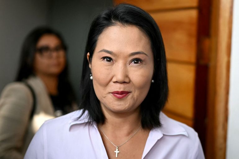 afp_6a2bc30f0ad3-1781252879 Peru's presidential candidate for the Fuerza Popular party, Keiko Fujimori, looks on before speaking to members of the media outside her house in Lima on June 11, 2026.