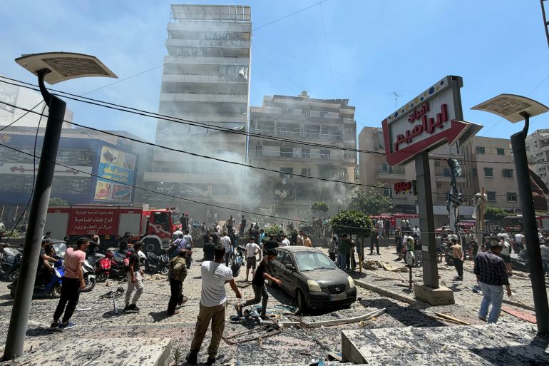 afp_6a2e8e0dc172-1781435917 People gather at the site of an Israeli airstrike that targeted a building in Beirut’s southern suburbs on June 14, 2026.