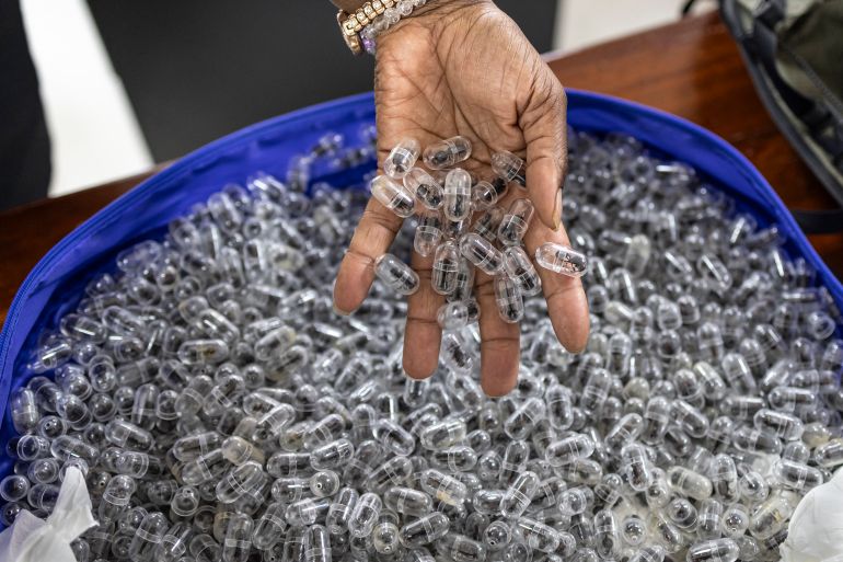 afp_6a2fc1444e5e-1781514564 (FILES) A Kenya Wildlife Services (KWS) warden displays some of the syringe cartridges modified to carry live ants at the Jomo Kenyatta International Airport law courts in Nairobi on March 17, 2026. (Photo by Tony KARUMBA / AFP)