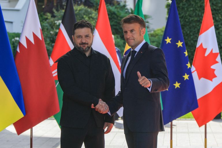 afp_6a30fbee47f0-1781595118 France's President Emmanuel Macron greets Ukraine's President Volodymyr Zelensky ahead of the working session with G7 leaders and Ukraine during the G7 summit, in Evian, eastern France, on June 16, 2026.