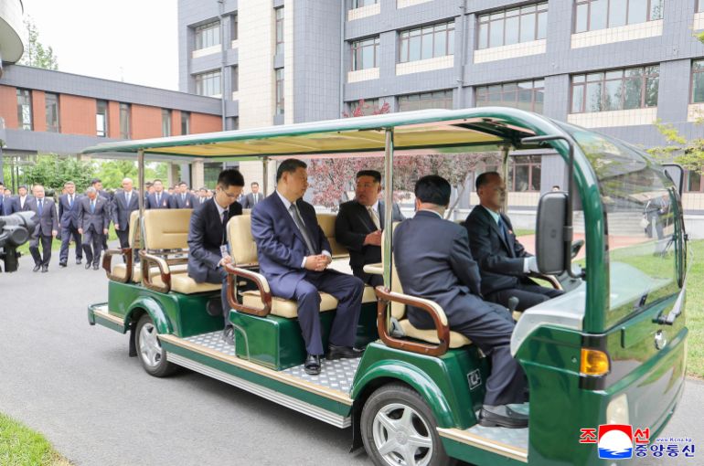 afp_6a3518f764bb-1781864695 This picture taken on June 9, 2026 and released by North Korea's official Korean Central News Agency (KCNA) on June 10, 2026 shows North Korean leader Kim Jong Un (center R) and China's President Xi Jinping (center L) visiting the Central Cadres Training School of the Workers' Party of Korea in Pyongyang.