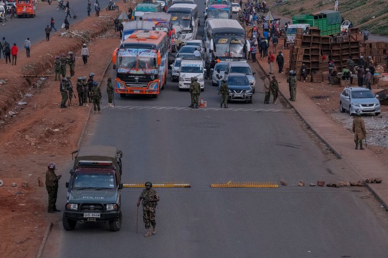 Kenyan police officers man a roadblock in the Central Business District (CBD) in the Kangemi neighbourhood ahead of the planned demonstrations to mark the second anniversary of the deadly June 2024 youth-led anti-Finance Bill protests, which saw demonstrators storm Parliament, in Nairobi on June 25, 2026.
