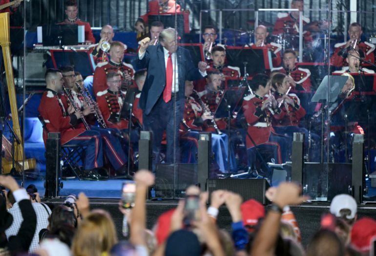 US President Donald Trump dances on stage after speaking during the kick-off celebration for the "Great American State Fair" on the National Mall in Washington, DC, June 24, 2026.