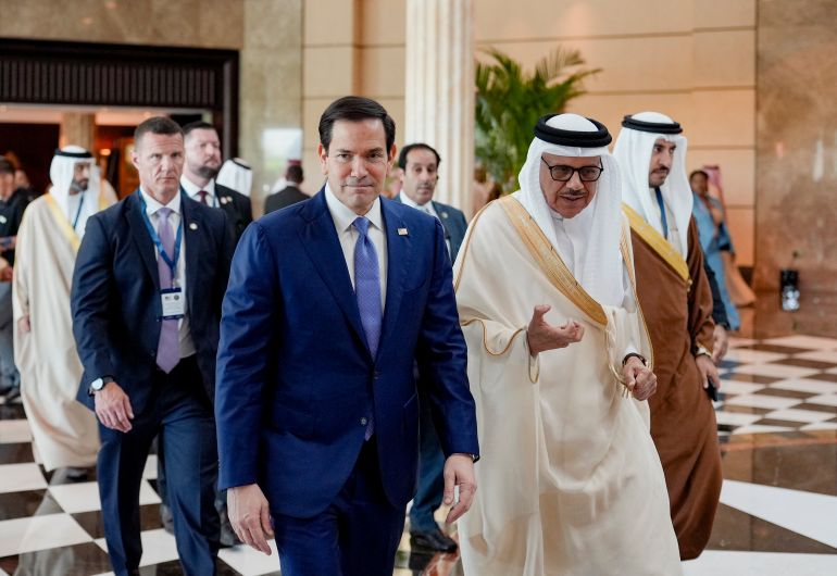 US Secretary of State Marco Rubio (L) walks along side Bahrain's Foreign Minister and Chairman of the GCC Ministerial Council session Abdullatif bin Rashid al-Zayani following a meeting with foreign ministers of the Gulf Cooperation Council Member States (GCC), in Manama on June 25, 2026.