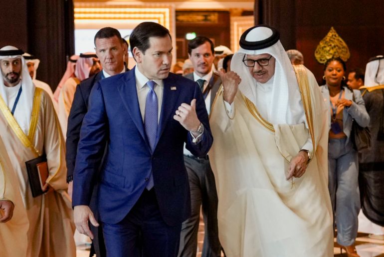US Secretary of State Marco Rubio (L) walks along side Bahrain's Foreign Minister and Chairman of the GCC Ministerial Council session Abdullatif bin Rashid al-Zayani following a meeting with foreign ministers of the Gulf Cooperation Council Member States (GCC), in Manama on June 25, 2026.