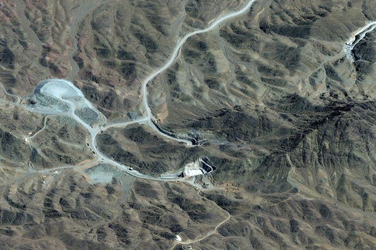afp__20260307_-1776671848 This handout satellite image courtesy of Vantor shows an overview of the Pickaxe Mountain tunnel complex adjacent to the Natanz Nuclear Facility near Natanz, Isfahan province, in central Iran on March 7, 2026. (Photo by Satellite image ©2026 Vantor / AFP)