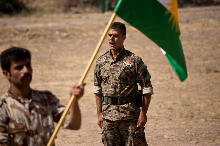 In this Wednesday, Sept. 21, 2016 photo, a commander instructs new recruits of the Democratic Party of Iranian Kurdistan during training at their base in Koya, northern Iraq. The main Kurdish opposition group in Iran will keep up its guerrilla campaign against security forces “to protect and defend” Kurds living there. That’s according to the deputy leader of the Democratic Party of Iranian Kurdistan. He calls the fight necessary after the Islamic Republic’s nuclear deal with world powers.(AP Photo/Maya Alleruzzo)