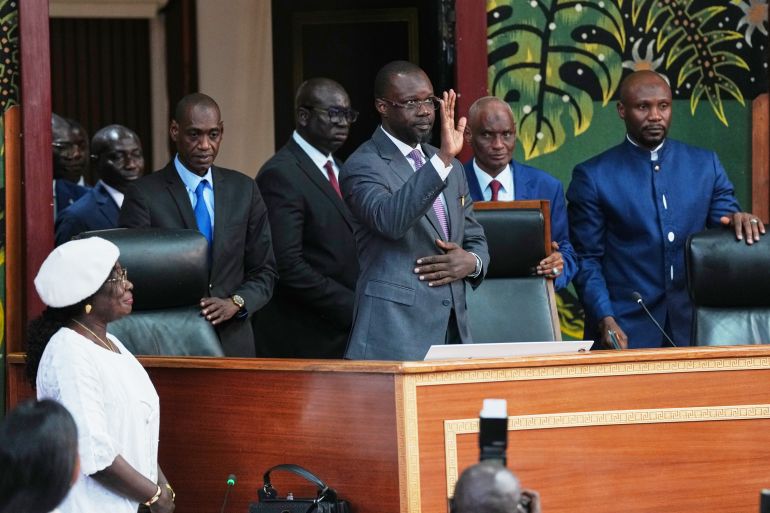 Ousmane Sonko, center, arrives to deliver a speech following his election as President of the National Assembly in Dakar, Senegal, Tuesday, May 26, 2026. (AP Photo/Misper Apawu) CORRECTION: Name corrected to Ousmane instead of Ousman
