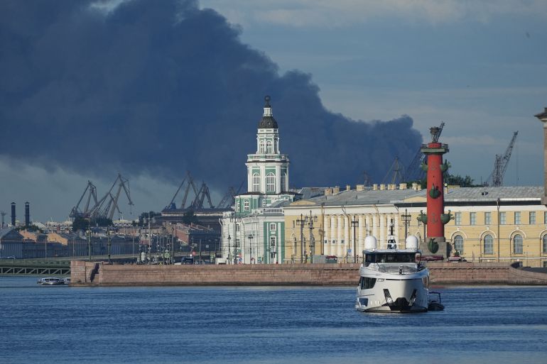 A plumes of black smoke is seen over the port of St. Petersburg, Russia, Wednesday, June 3, 2026, after a Ukrainian drone attack. (AP Photo)
