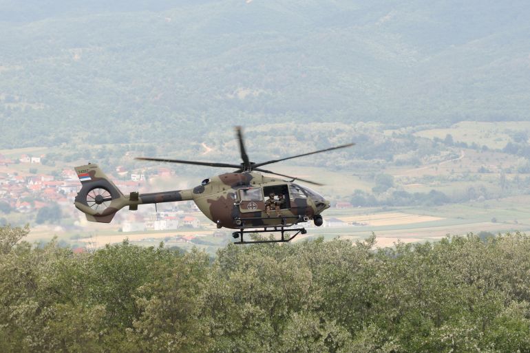 Serbian Army soldiers and soldiers from NATO countries perform during a first Serbia-NATO joint military exercise at training ground near the village of Borovac, south Serbia, Friday, May 22, 2026. (AP Photo/Jelena Djukic-Pejic)