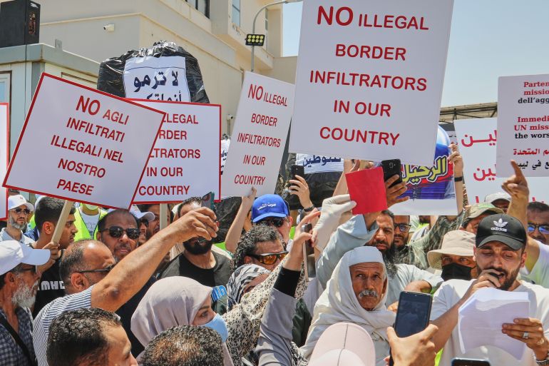 Libyans demonstrate in front of the UNHCR office in Tripoli, Libya, Thursday, June 4, 2026, demanding the departure of the UNHCR office. (AP Photo/Yousef Murad)