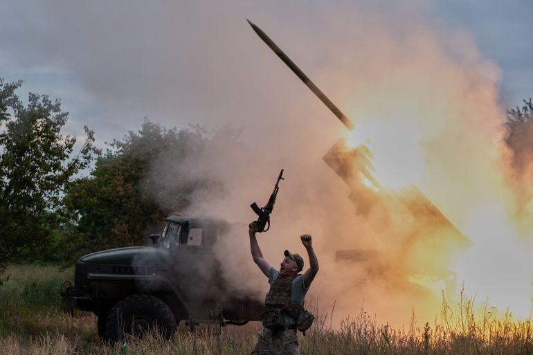 In this photo provided by Ukraine's 93rd Kholodnyi Yar Separate Mechanized Brigade press service, a soldier reacts as an MRLS BM-21 "Grad" fires at the Russian positions near Kostiantynivka, Donetsk region, Ukraine, Thursday, June 4, 2026. (Iryna Rybakova/Ukraine's 93rd Mechanized Brigade via AP)