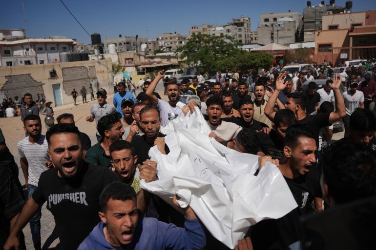 ap_6a2692b3eeba9-1780912819-1 Palestinians carry the body of Ismail al-Laham, who was killed in an Israeli airstrike in Khan Younis, southern Gaza Strip, Sunday, June 7, 2026. (AP Photo/Abdel Kareem Hana)