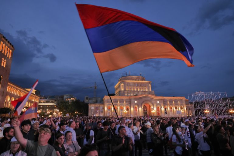 ap_6a27188e06803-1780947086 Supporters of Russian-Armenian tycoon Samvel Karapetyan, wave a Armenian national flag during a rally against incumbent Prime Minister Nikol Pashinyan at Republic Square in Yerevan, Armenia, Wednesday, June 3, 2026, as Karapetyan, who heads the Strong Armenia party, has faced criminal charges that he rejected as politically driven and campaigned from under house arrest. (AP Photo/Anthony Pizzoferrato)
