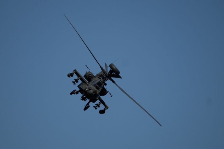 ap_6a27a0379d2fd-1780981815 An Apache helicopter flies as soldiers take part in the U.S.-led Immediate Response 25 military exercise in Petrochori, northern Greece Wednesday, June 4, 2025. (AP Photo/Thanassis Stavrakis)