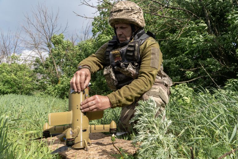ap_6a27ee83e0e7c-1781001859 A Ukrainian soldier prepares an interceptor drone during a Russia's aerial attack at an undisclosed location near Kharkiv, Ukraine, Monday, May 25, 2026. (AP Photo/Andrii Marienko)