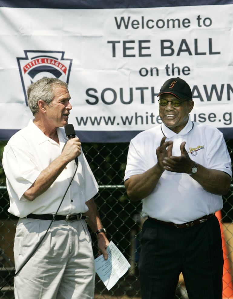 FILE - President George W. Bush, left, and National Baseball Hall of Fame member Willie Mays open the White House Tee Ball Game on the South Lawn, Sunday, July 30, 2006, in Washington. (AP Photo/Manuel Balce Ceneta, File)